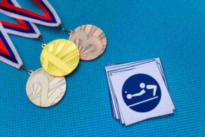 Table Tennis icon and medal set, gold silver and bronze medal, blue background.